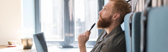 side-view-man-thinking-while-working-1