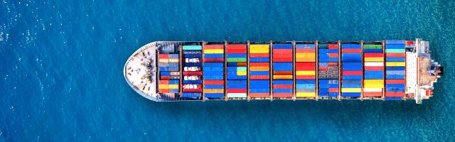 Aerial view of container cargo ship in sea.