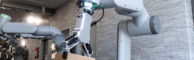 Dos cobots trabajando cogiendo cajas.